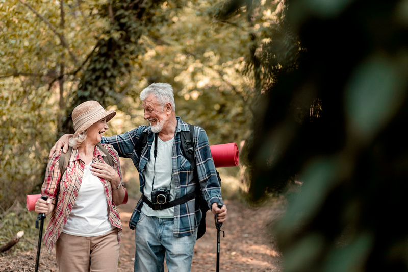Older couple hikes outdoors