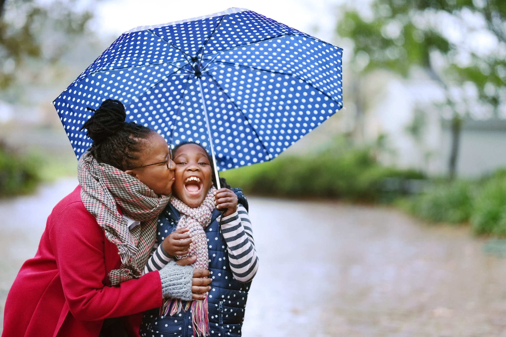 mother daughter in the rain