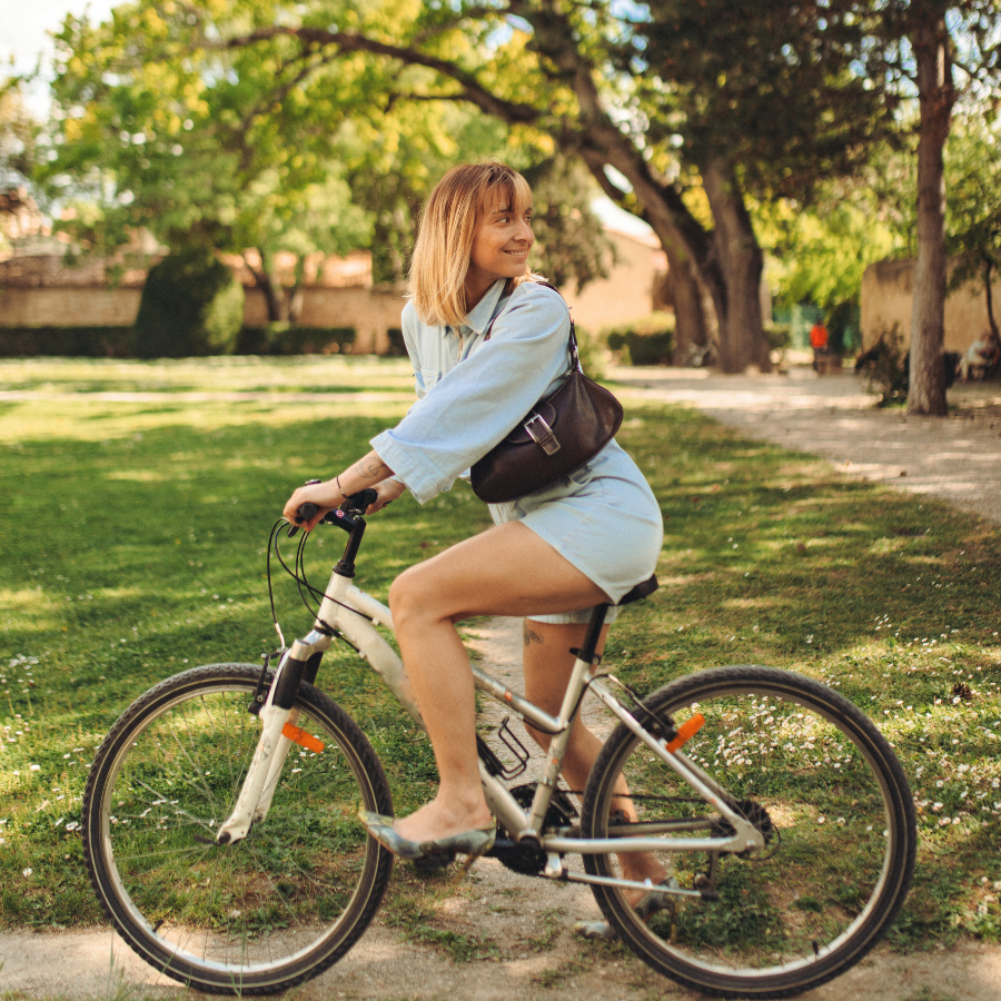 Couple on a tandem bike at sunset
